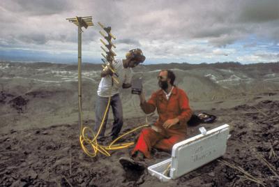 Scientists from the U.S. and Philippines install a new seismic station after 15 June 1991 eruption of Mount Pinatubo, Philippines. (Click image to view full size.)