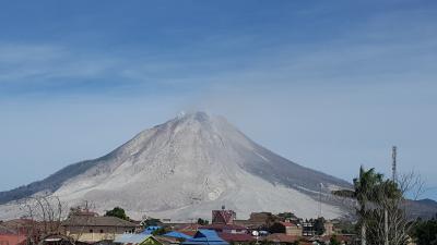 Sinabung Volcano, Indonesia. Fresh eruption deposits visible on the flanks. Photo taken between small explosive events in 2016. (Click image to view full size.)
