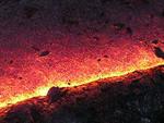 Lava picking up flakes of crust, Kohola flow, Kilauea volcano, Hawai`i