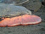 Lava in Kohola flow rolls down slope near Wilipe`a, Kilauea volcano, Hawai`i