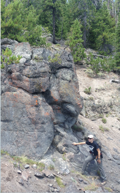 Christy Till, a scientist at Arizona State University points to one of the crystal black box recorders in the Scaup Lake lava flow, which erupted at Yellowstone around 256,000 years ago. (Click image to view full size.) Christy Till, a scientist at Arizona State University points to one of the crystal black box recorders in the Scaup Lake lava flow, which erupted at Yellowstone around 256,000 years ago. (Click image to view full size.)