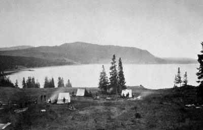 "Earthquake camp" of the Hayden expedition in 1871, located on the north shore of Yellowstone Lake near Steamboat Point. (Click image to view full size.) "Earthquake camp" of the Hayden expedition in 1871, located on the north shore of Yellowstone Lake near Steamboat Point. (Click image to view full size.)